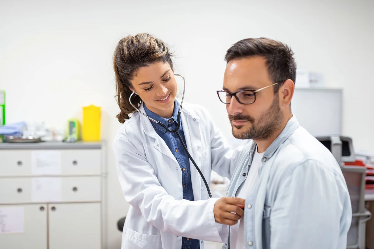 FirstCare Urgent Care physician examining a patient in Oak Lawn, IL